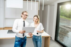 Young couple with tablet in the kitchen